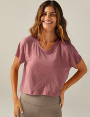 purple short sleeve scoop neck high-low t-shirt.
