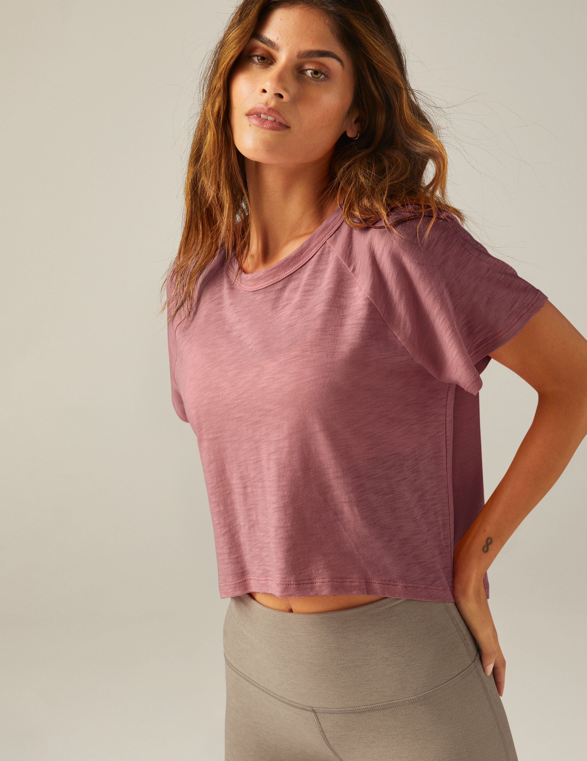 purple short sleeve scoop neck high-low t-shirt.