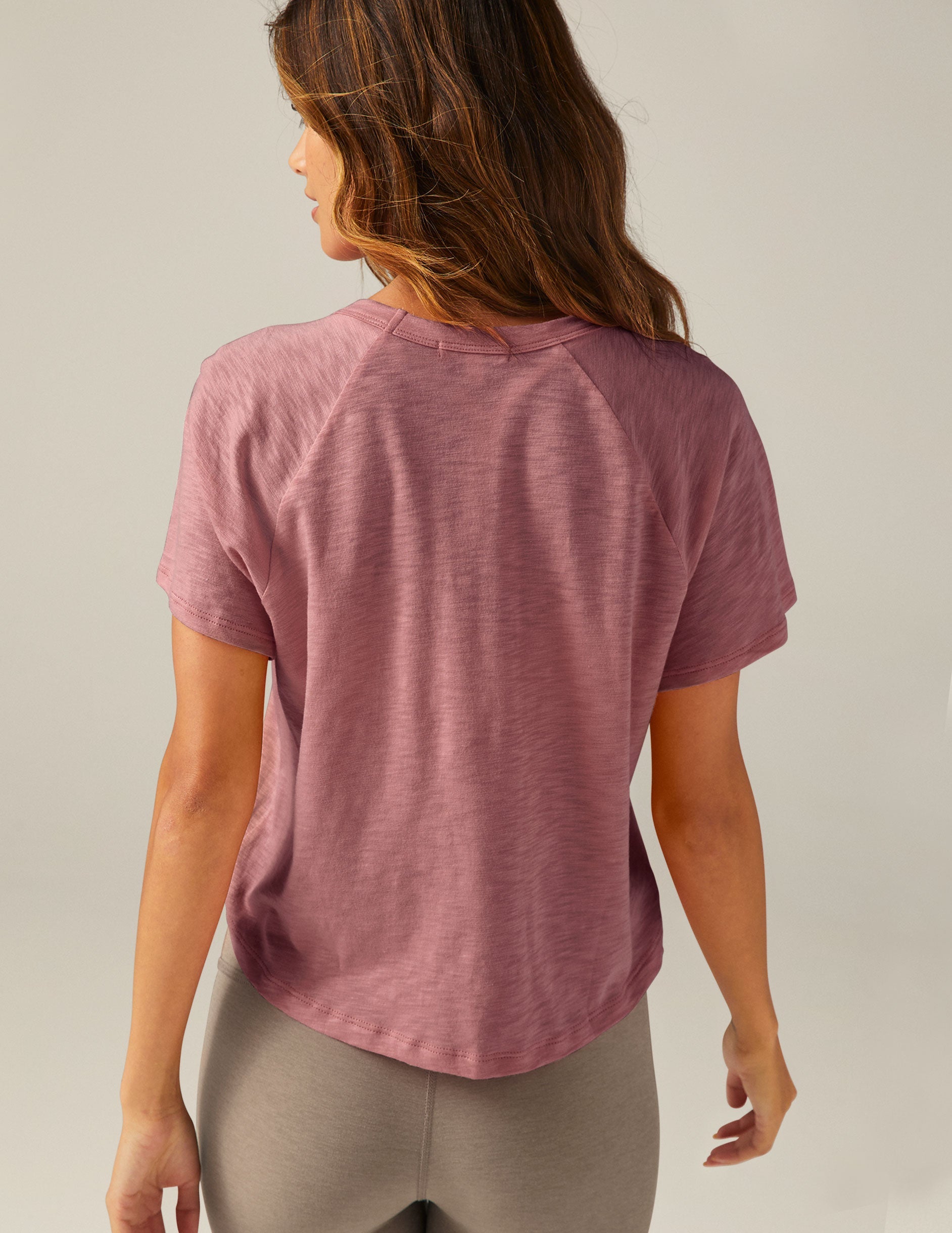 purple short sleeve scoop neck high-low t-shirt.