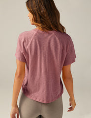 purple short sleeve scoop neck high-low t-shirt.