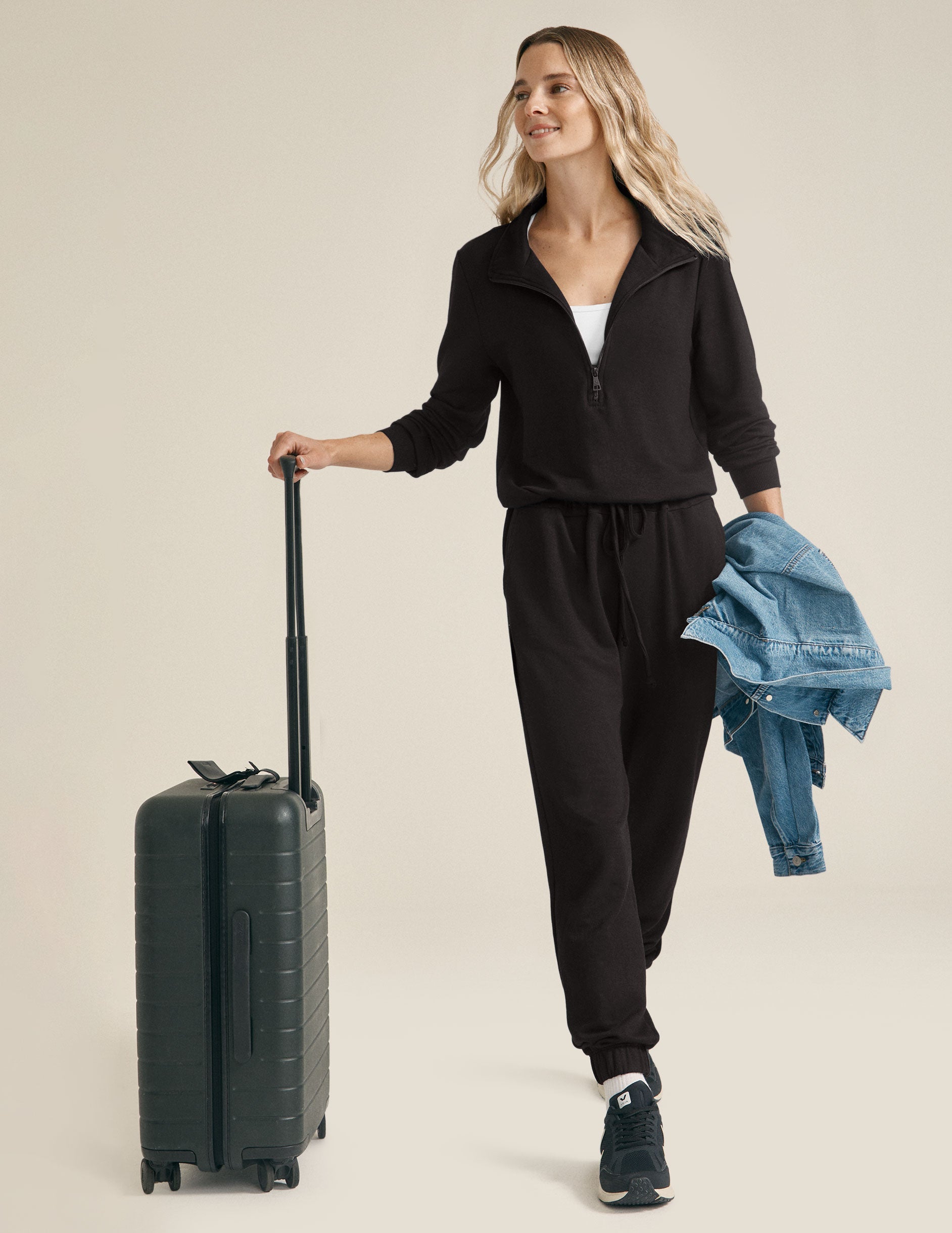 black half zip knit jumpsuit with drawstring at waist