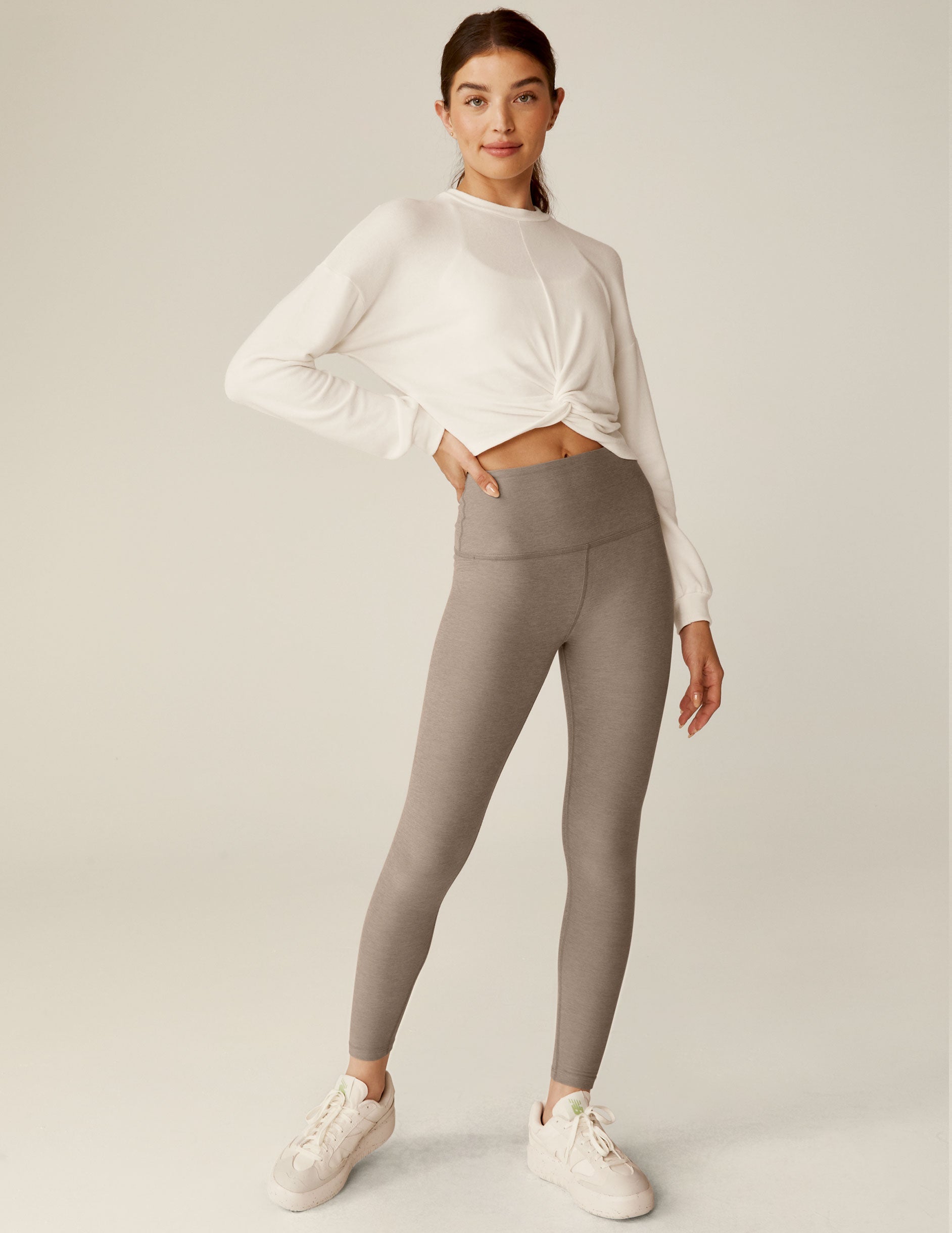 white crew neck relaxed fit cropped pullover with a detailing twist at front waist.