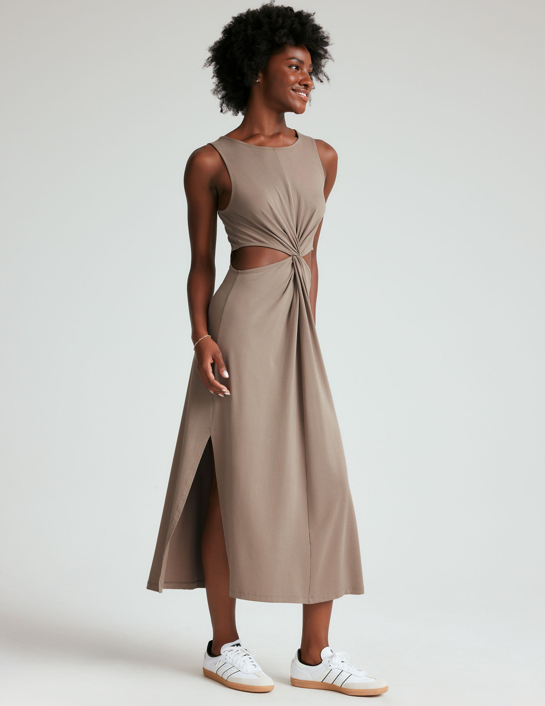 brown tank midi dress with cutouts and a twist detailing at waist and side slits.