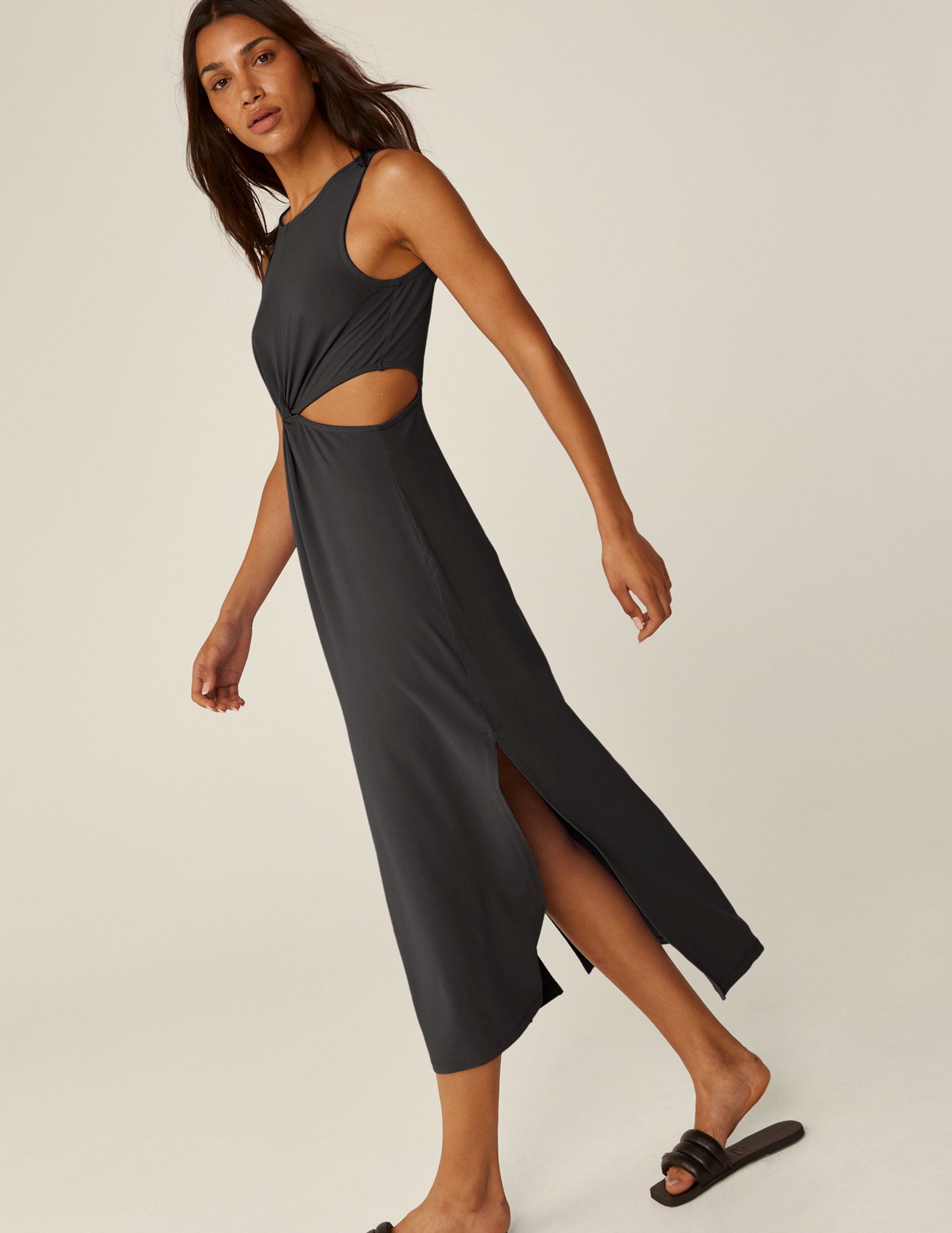 black maxi dress with cutouts at the waist.