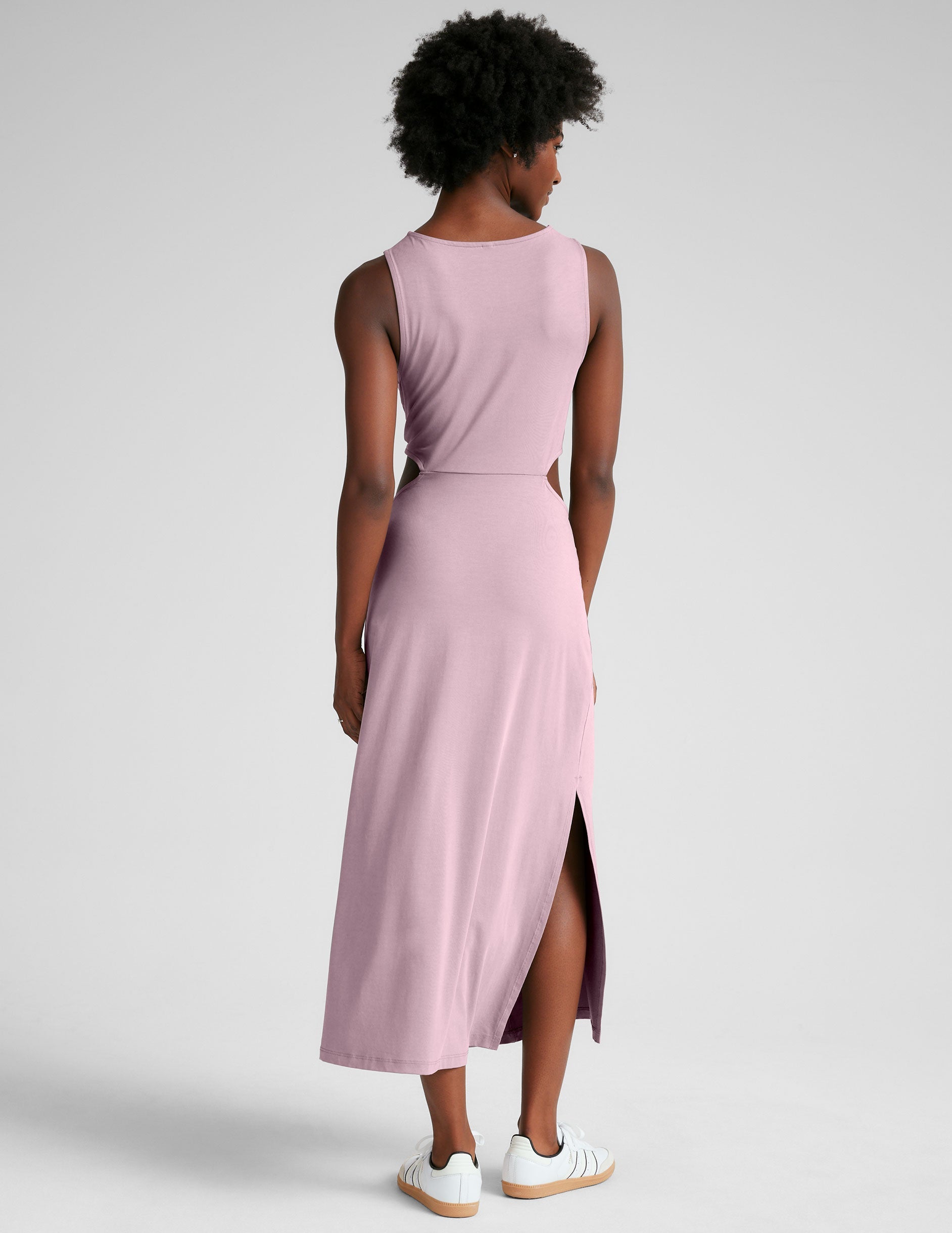 pink midi length tank dress with a scoop neckline and cutouts at waistband.
