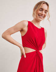 red midi length dress with a cutout detailing at waist.