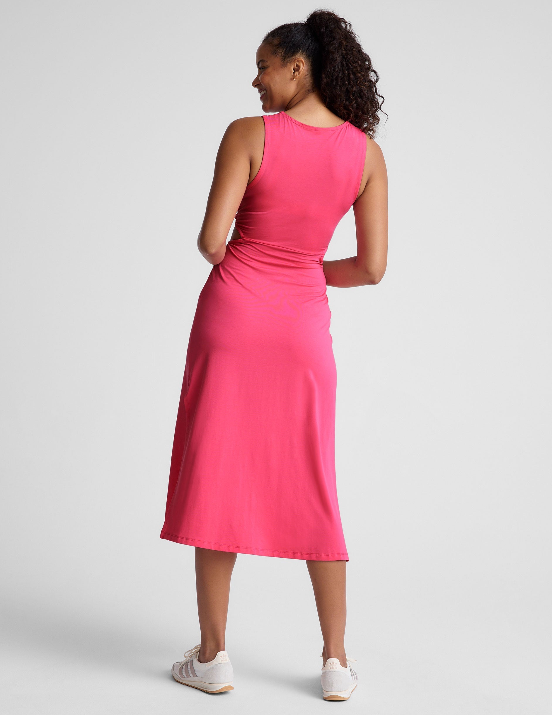pink midi dress with a front twist detailing at waist.