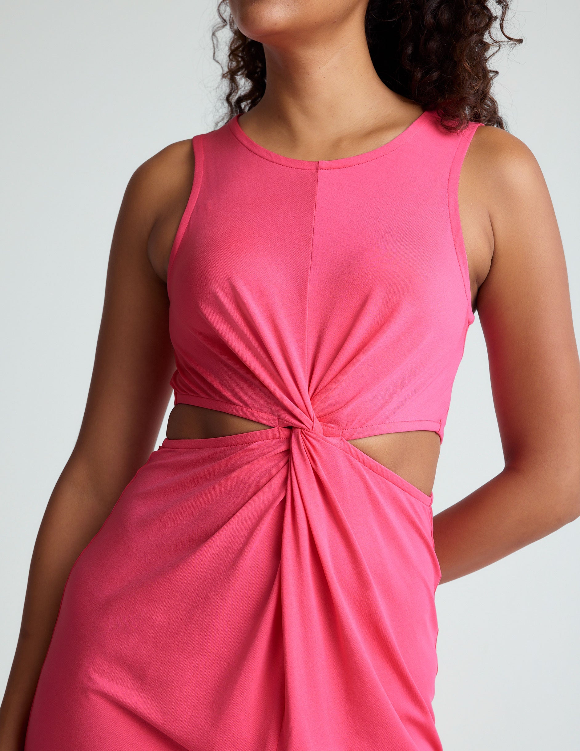 pink midi dress with a front twist detailing at waist.