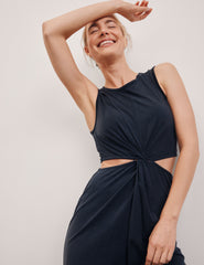 blue midi length thick strap tank dress with cutouts on sides of the waist and side slits on both sides of leg.