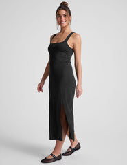 black midi dress with a square neckline and side slit.