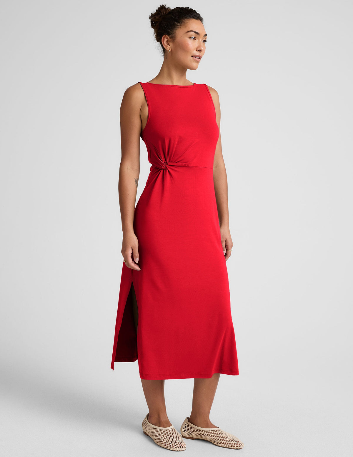 red midi dress with a bateau neck and side twist.