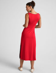 red midi dress with a bateau neck and side twist.
