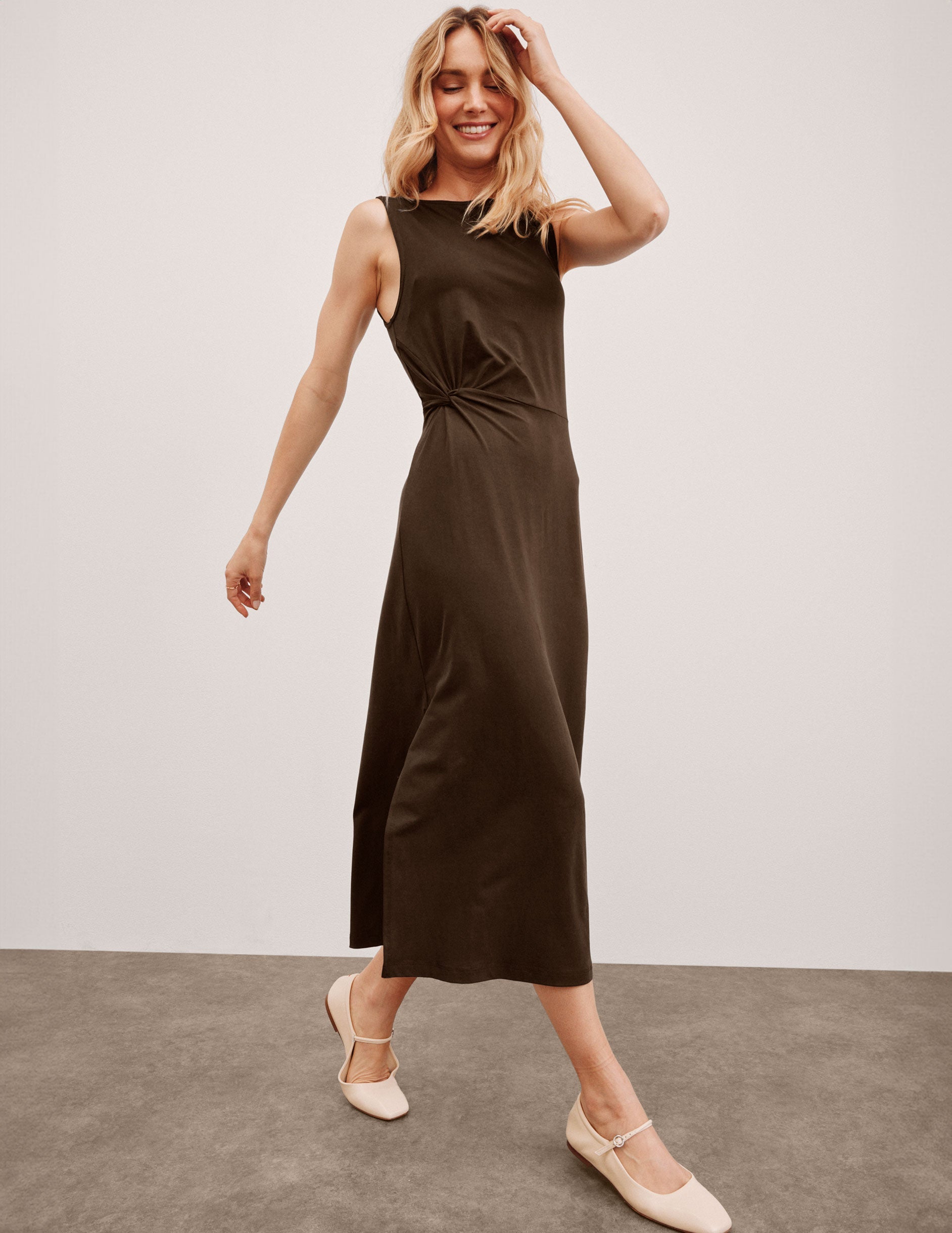 brown midi dress with a bateau neck and side twist.