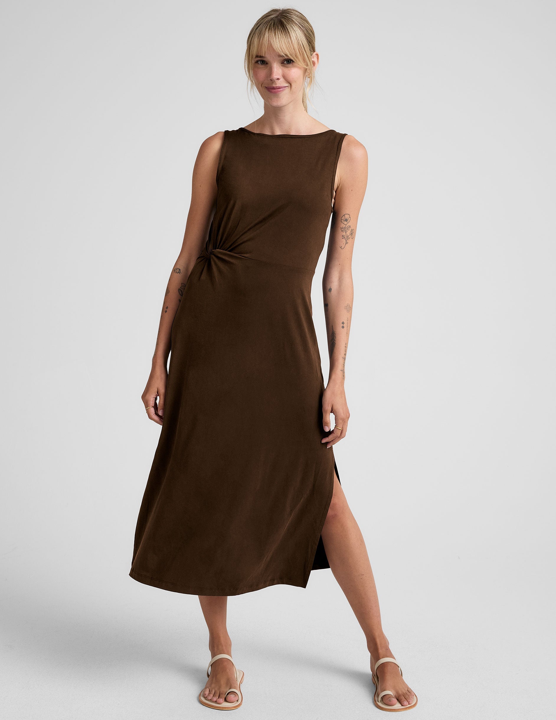 brown midi dress with a bateau neck and side twist.