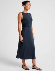blue midi dress with a bateau neck and side twist.
