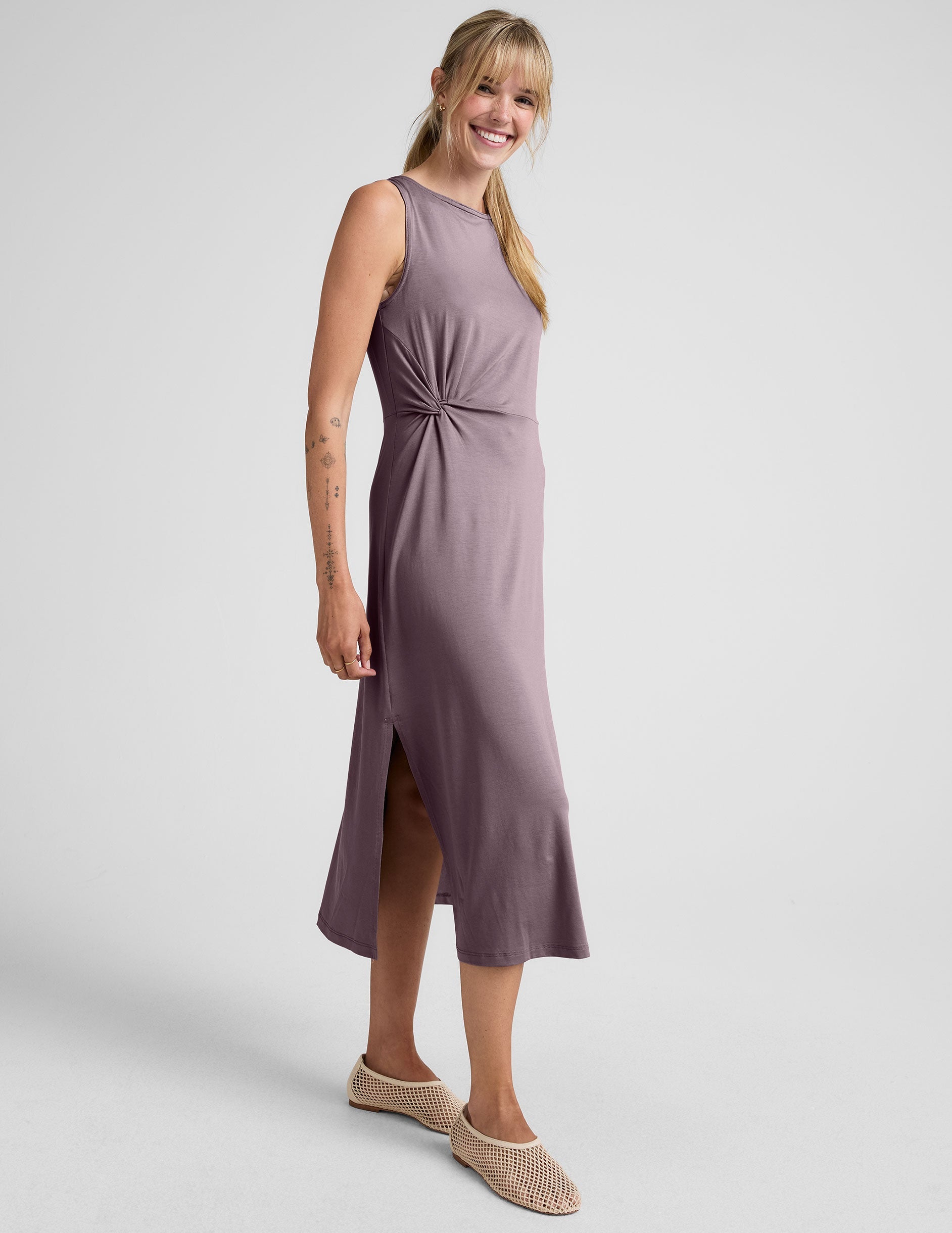 brown midi length dress with a side twist detail and side slit.