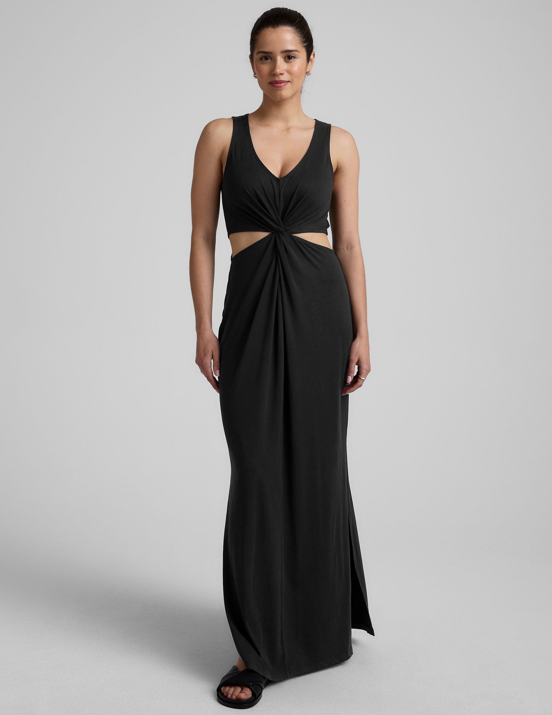 black v-neck maxi tank dress with cutouts at waist.