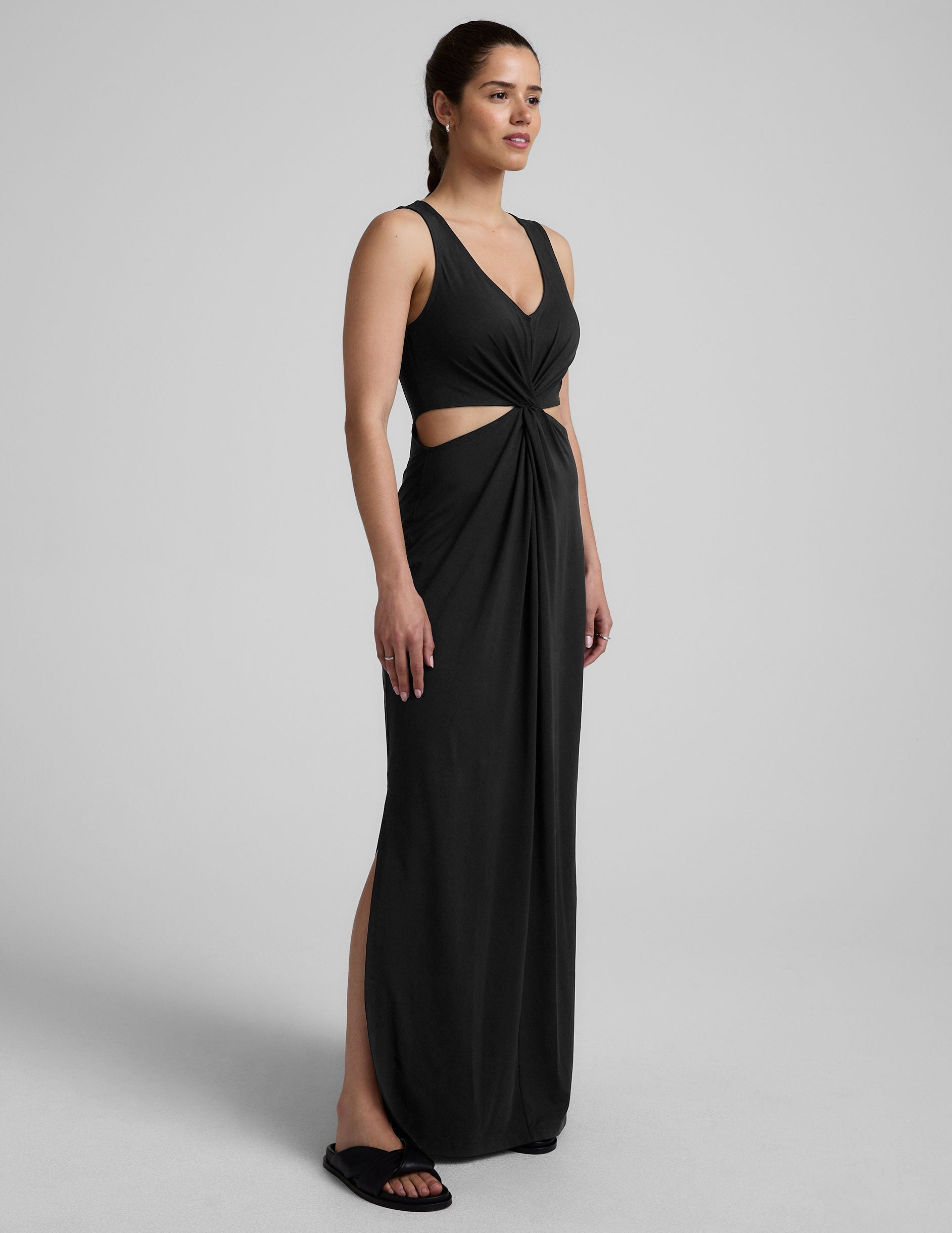 black v-neck maxi tank dress with cutouts at waist.