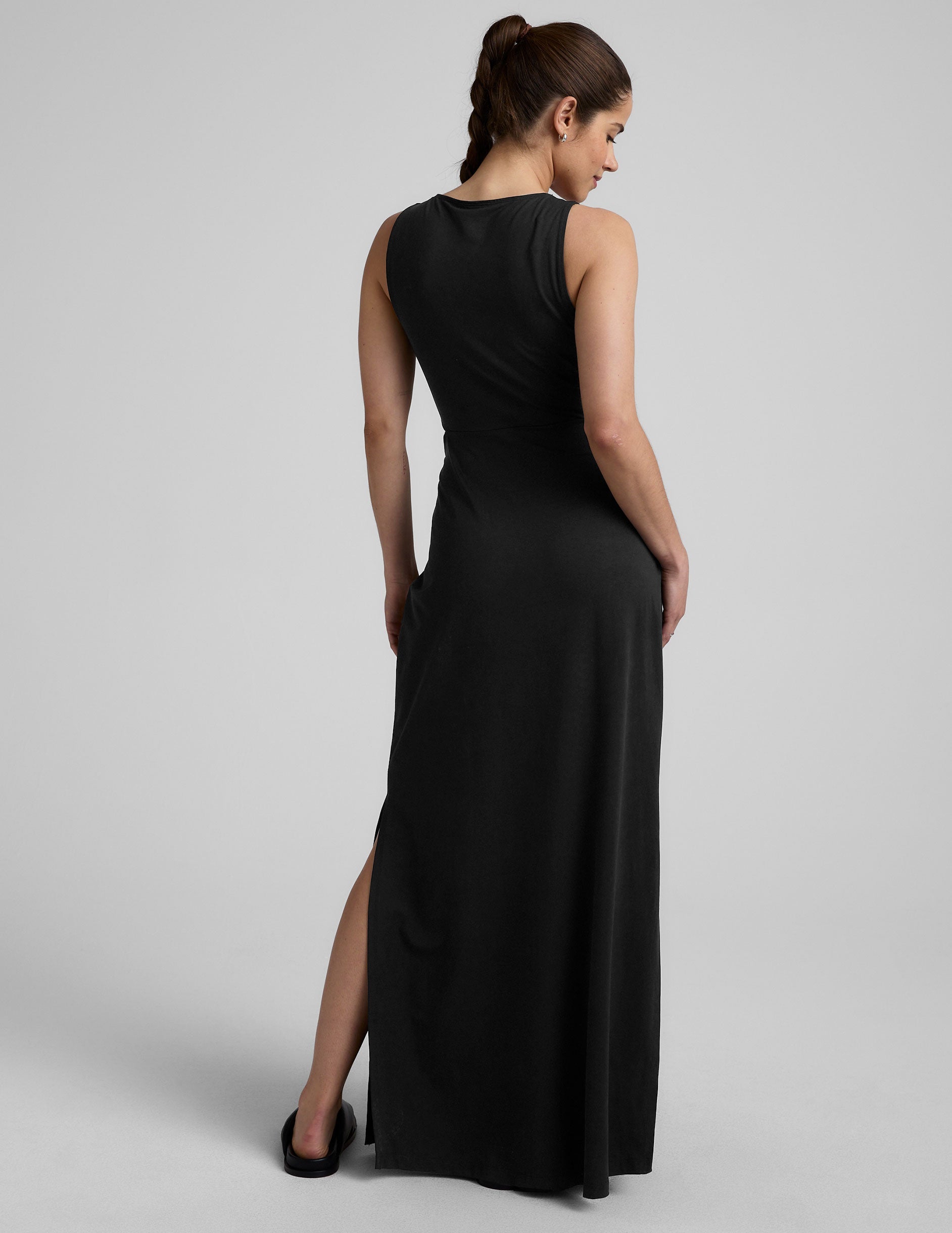 black v-neck maxi tank dress with cutouts at waist.