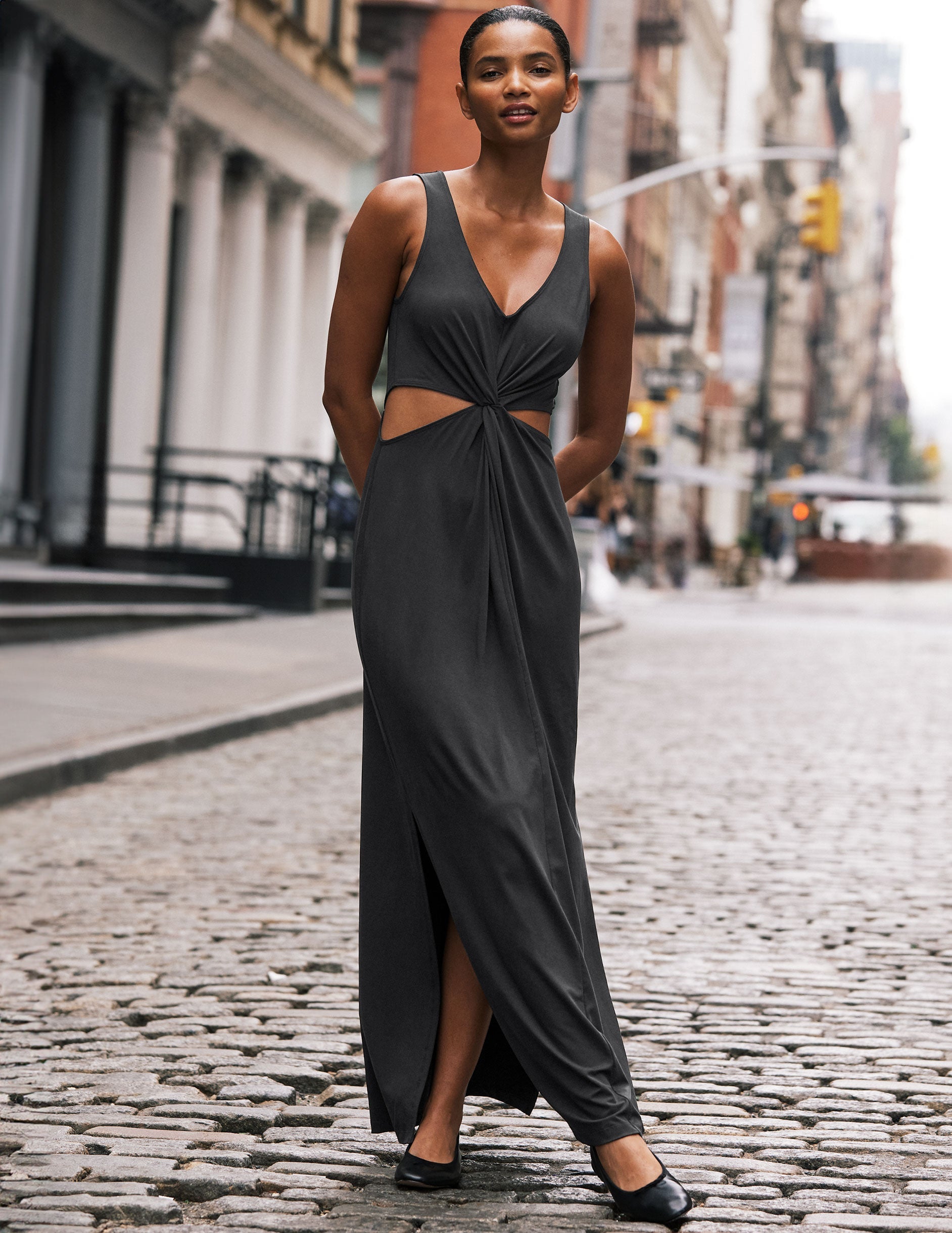 black v-neck maxi tank dress with cutouts at waist.