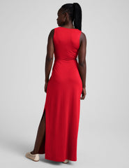 red maxi length tank dress with a v neckline and cutouts at waist.