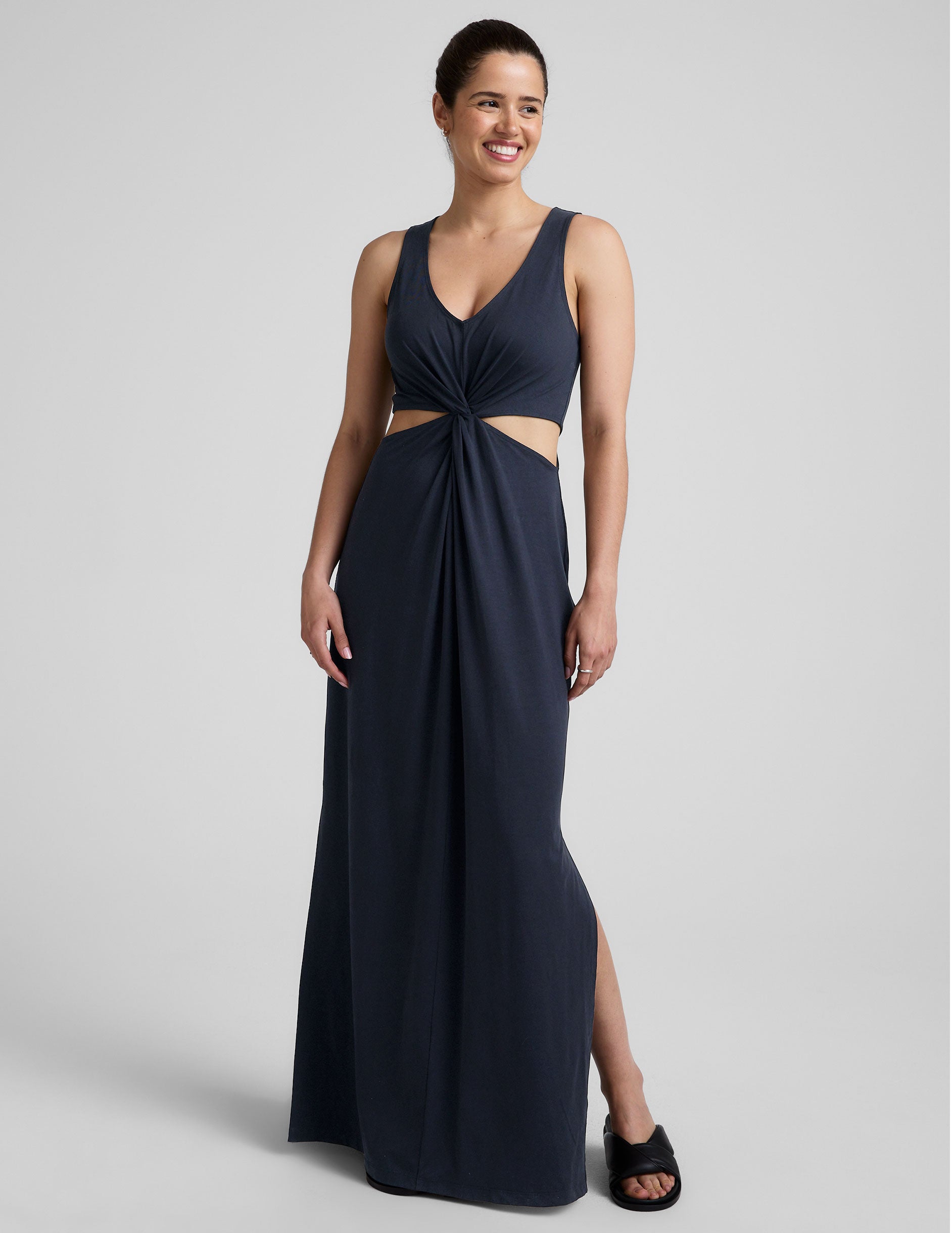 blue v-neck maxi length tank dress with cutouts at waist.
