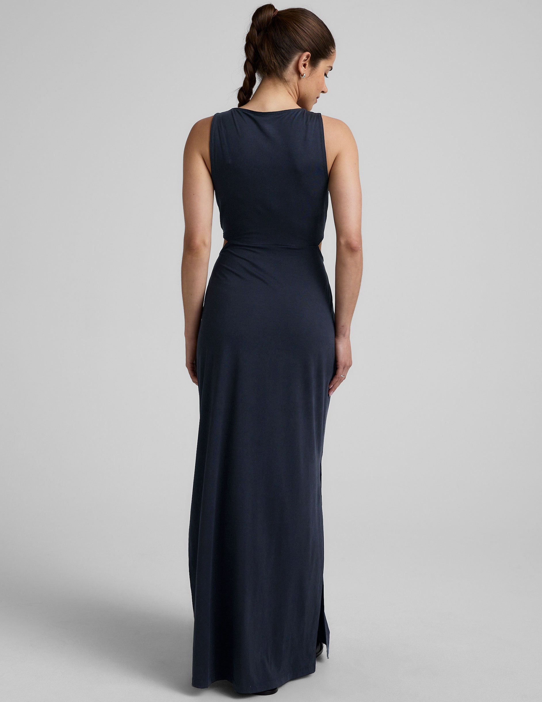 blue v-neck maxi length tank dress with cutouts at waist.