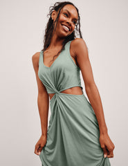 green v-neck maxi length tank dress with cutouts at the waist.