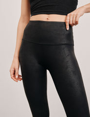 black faux leather high-waisted midi leggings.