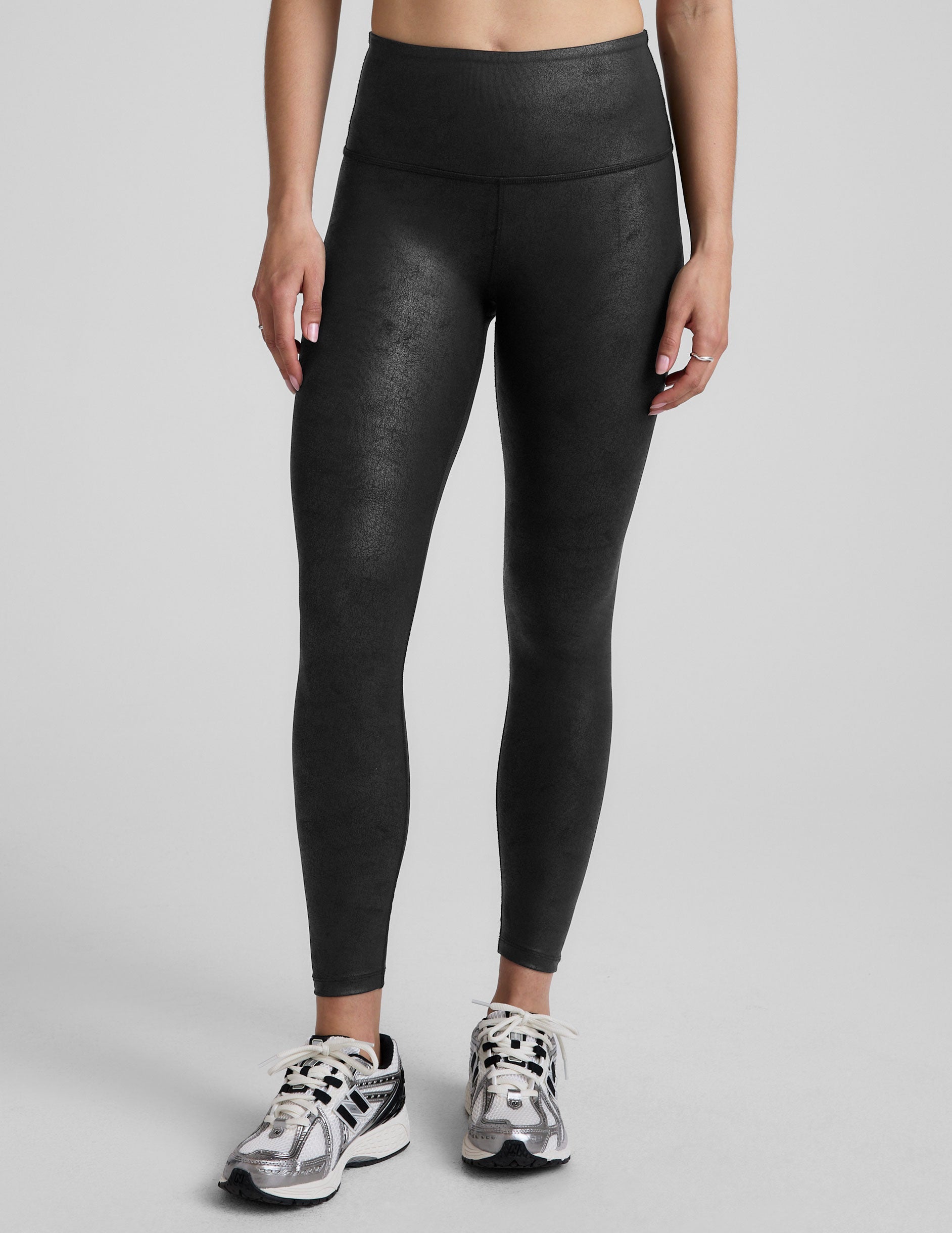 black faux leather high-waisted midi leggings.