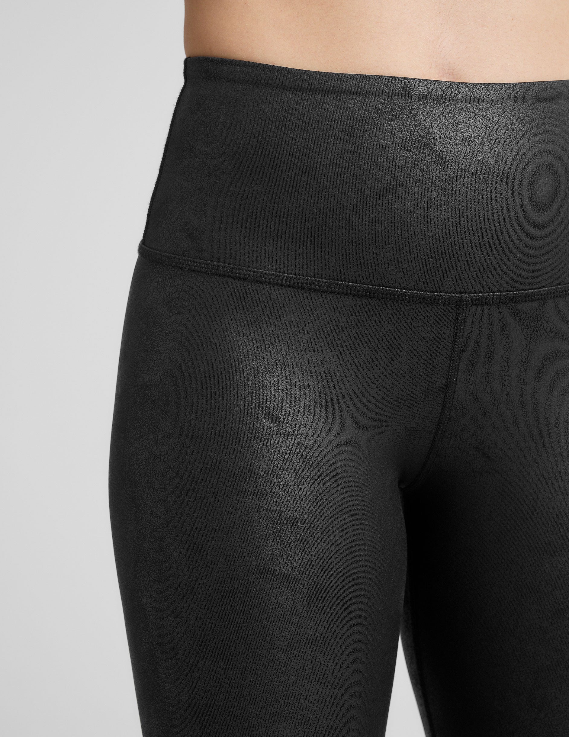 black faux leather high-waisted midi leggings.