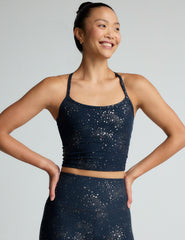 blue slim racerback cropped tank top with a gold star print.