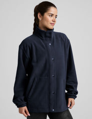 blue fleece button up jacket with a full front zip and snap closures and pockets.