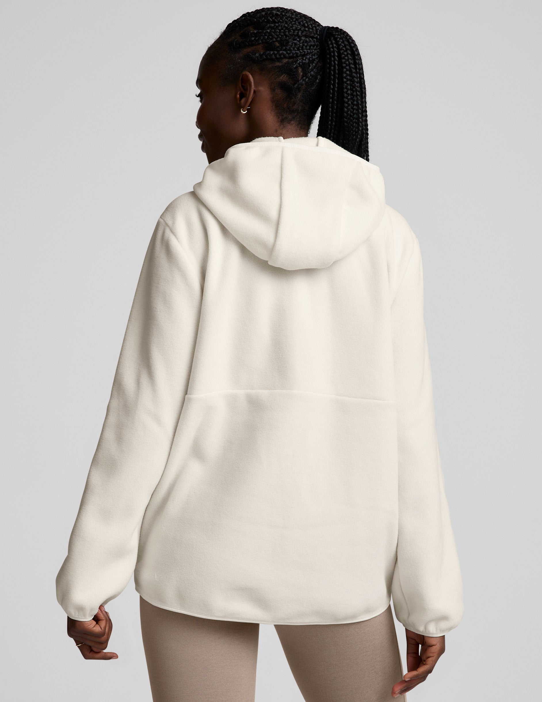 white fleece quarter zip jacket with a kangaroo pocket.