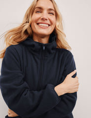 blue fleece quarter zip jacket with a kangaroo pocket.