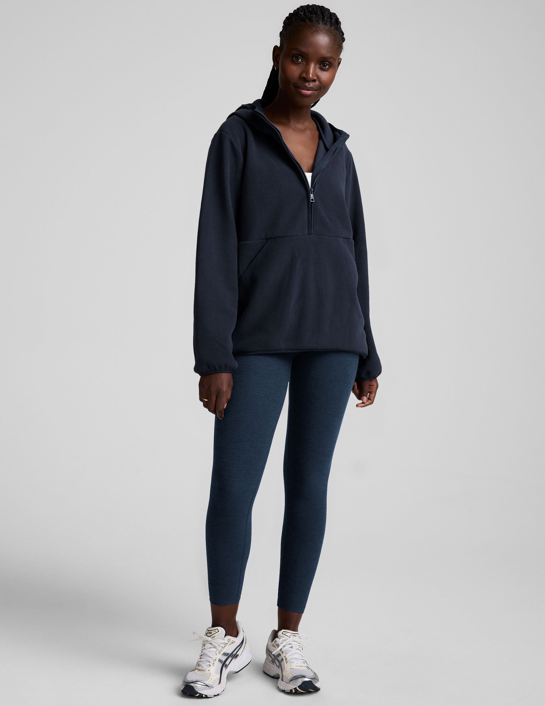 blue fleece quarter zip jacket with a kangaroo pocket.