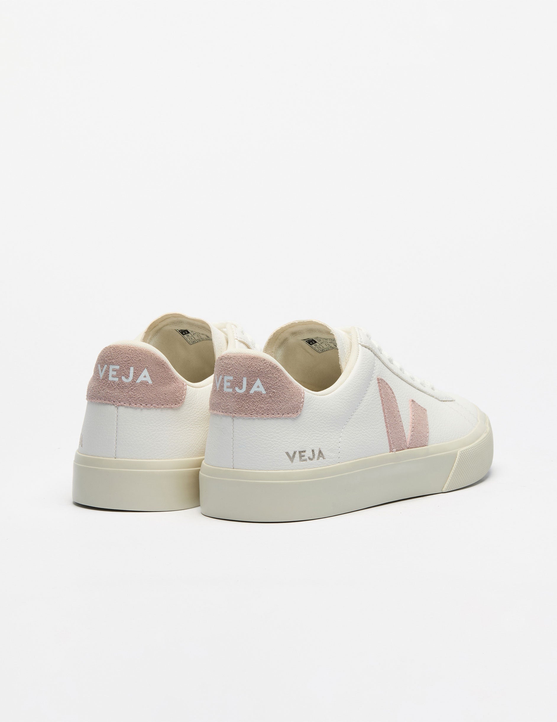 white low top VEJA sneakers with a pink logo detailing.
