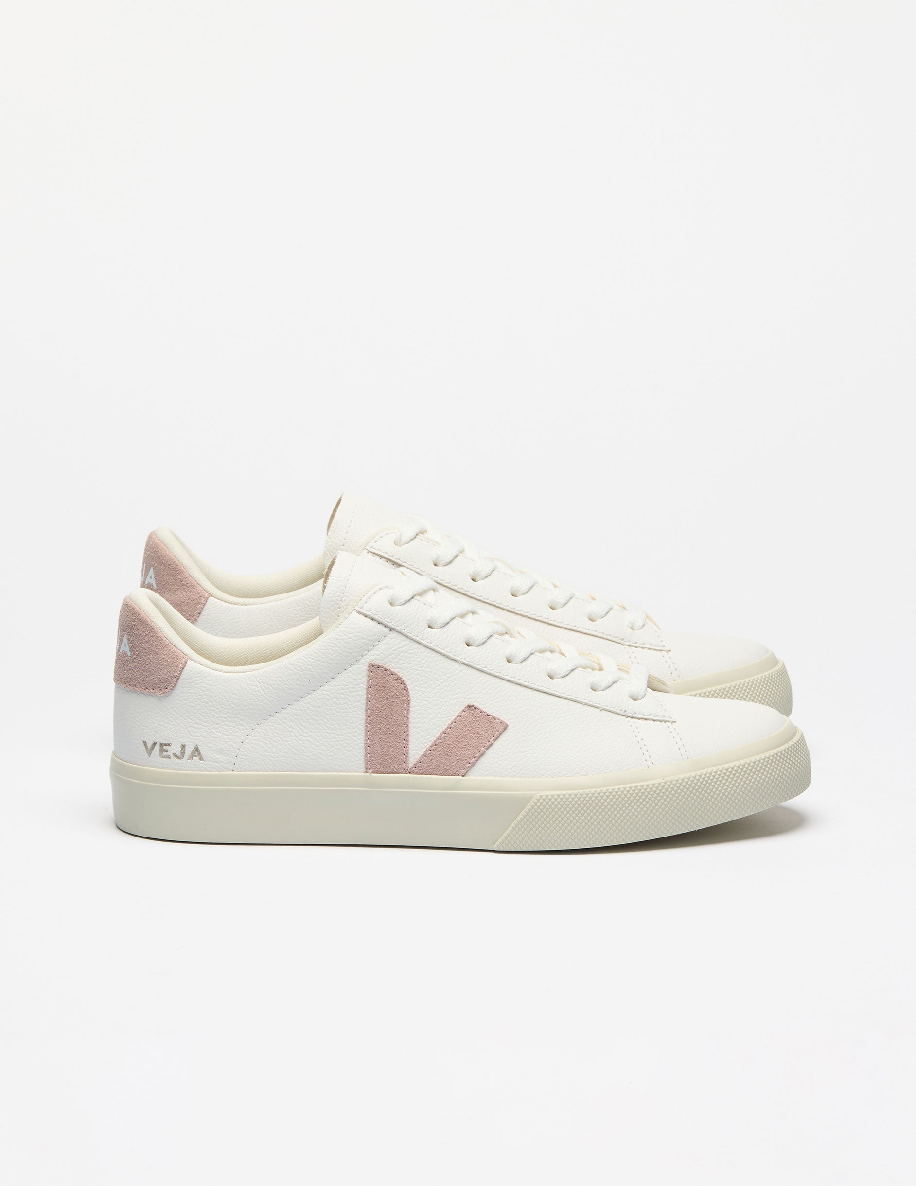 white low top VEJA sneakers with a pink logo detailing.
