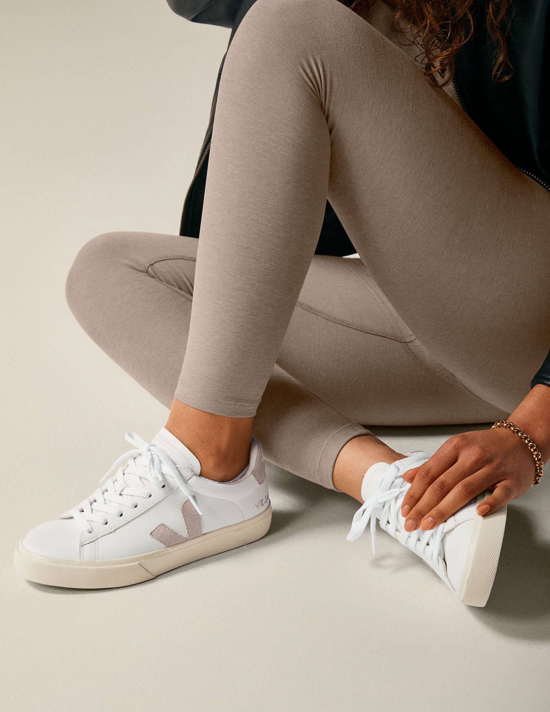 white and tan Veja sneakers.