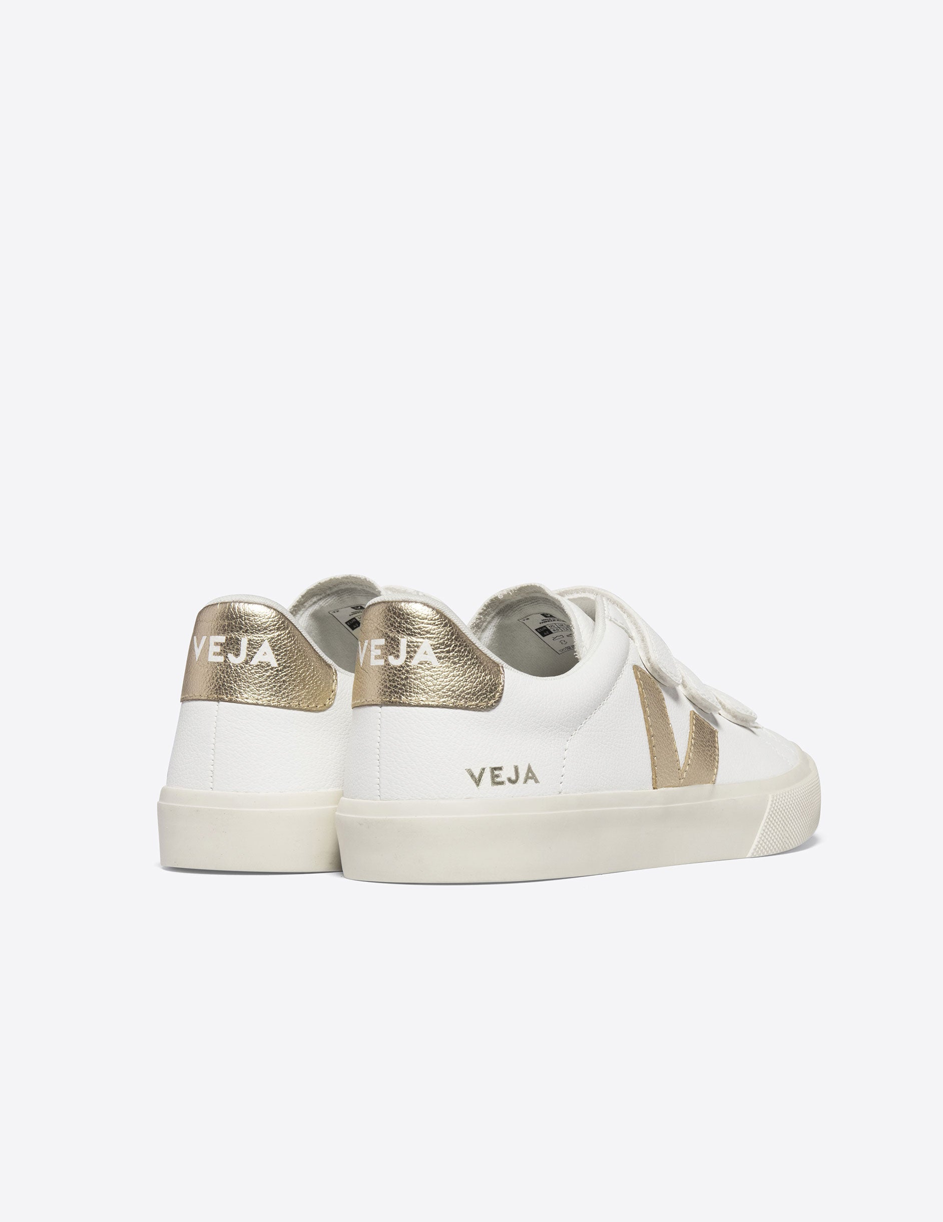 white VEJA sneakers with velcro straps.