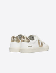 white VEJA sneakers with velcro straps.