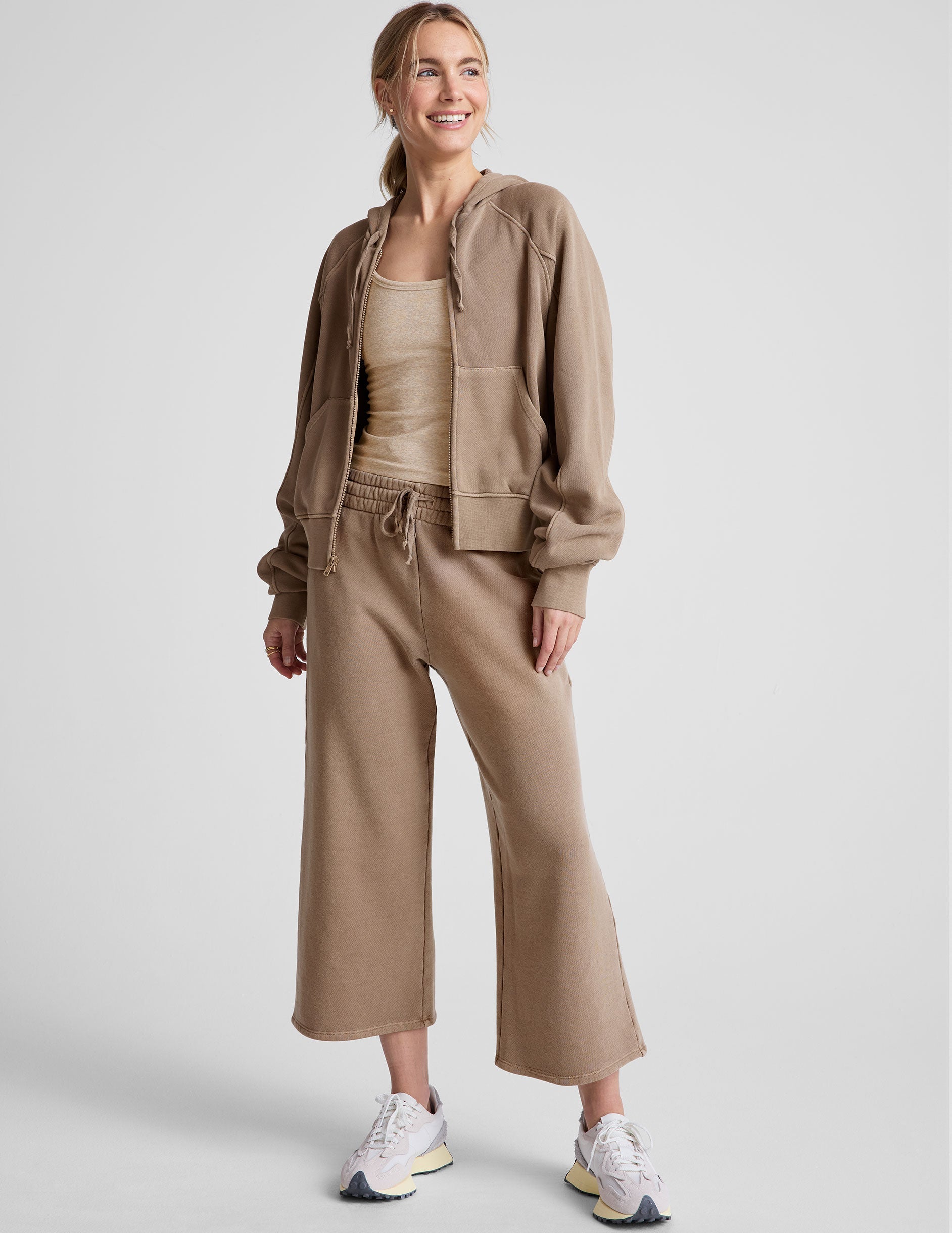 brown wide leg terry pants with a drawcord at waistband and pockets.