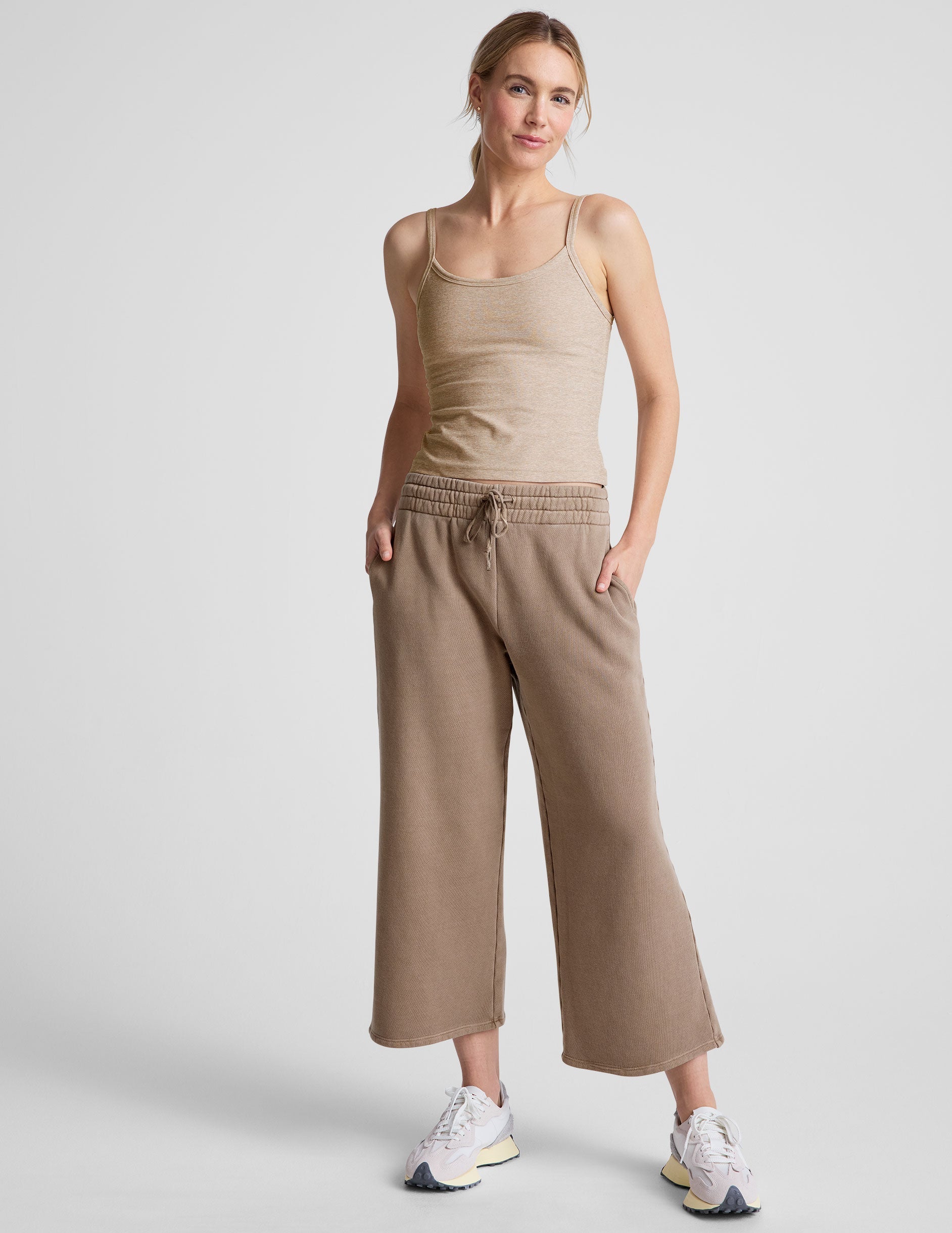 brown wide leg terry pants with a drawcord at waistband and pockets.