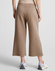 brown wide leg terry pants with a drawcord at waistband and pockets.
