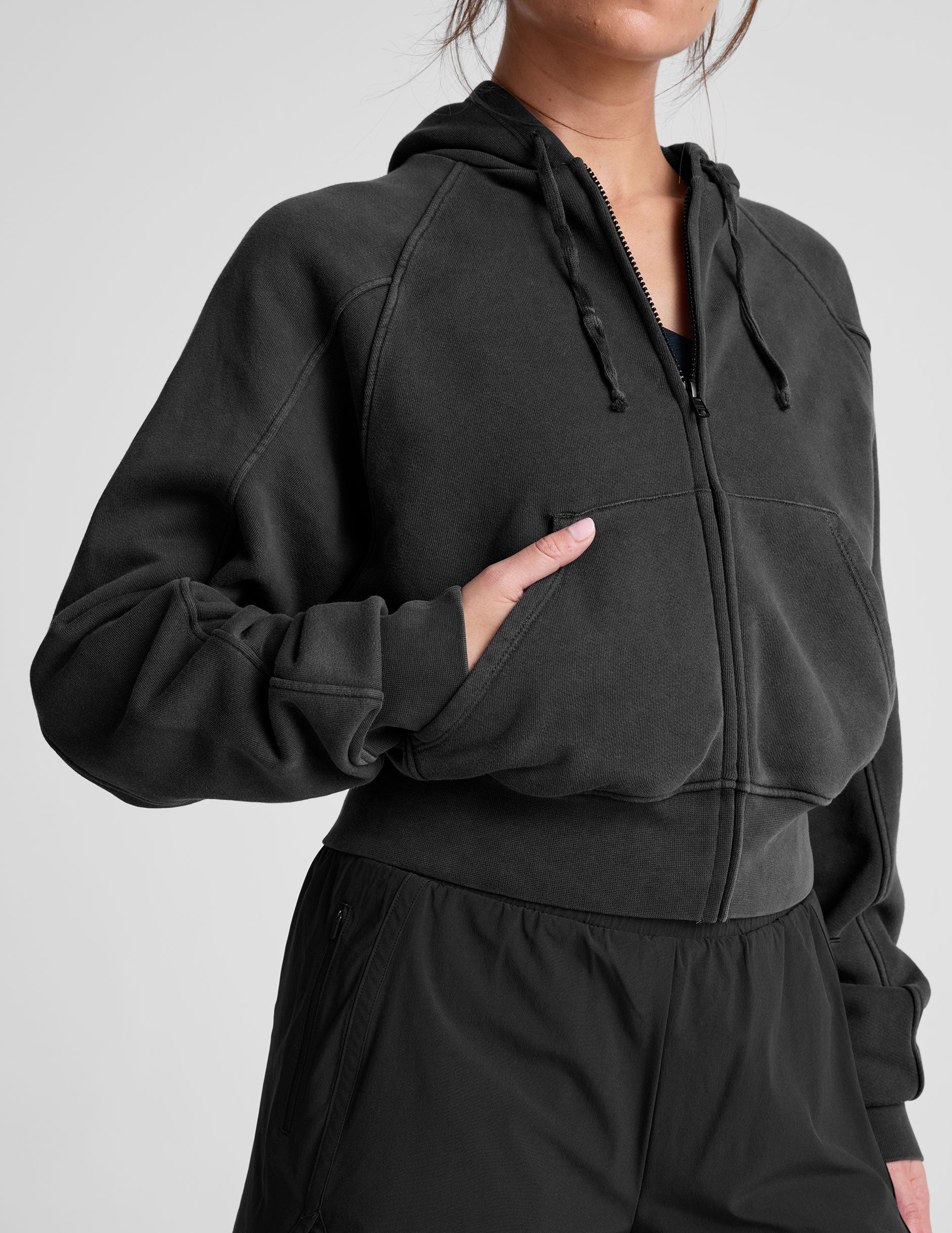 black zip-up hoodie jacket with pockets.
