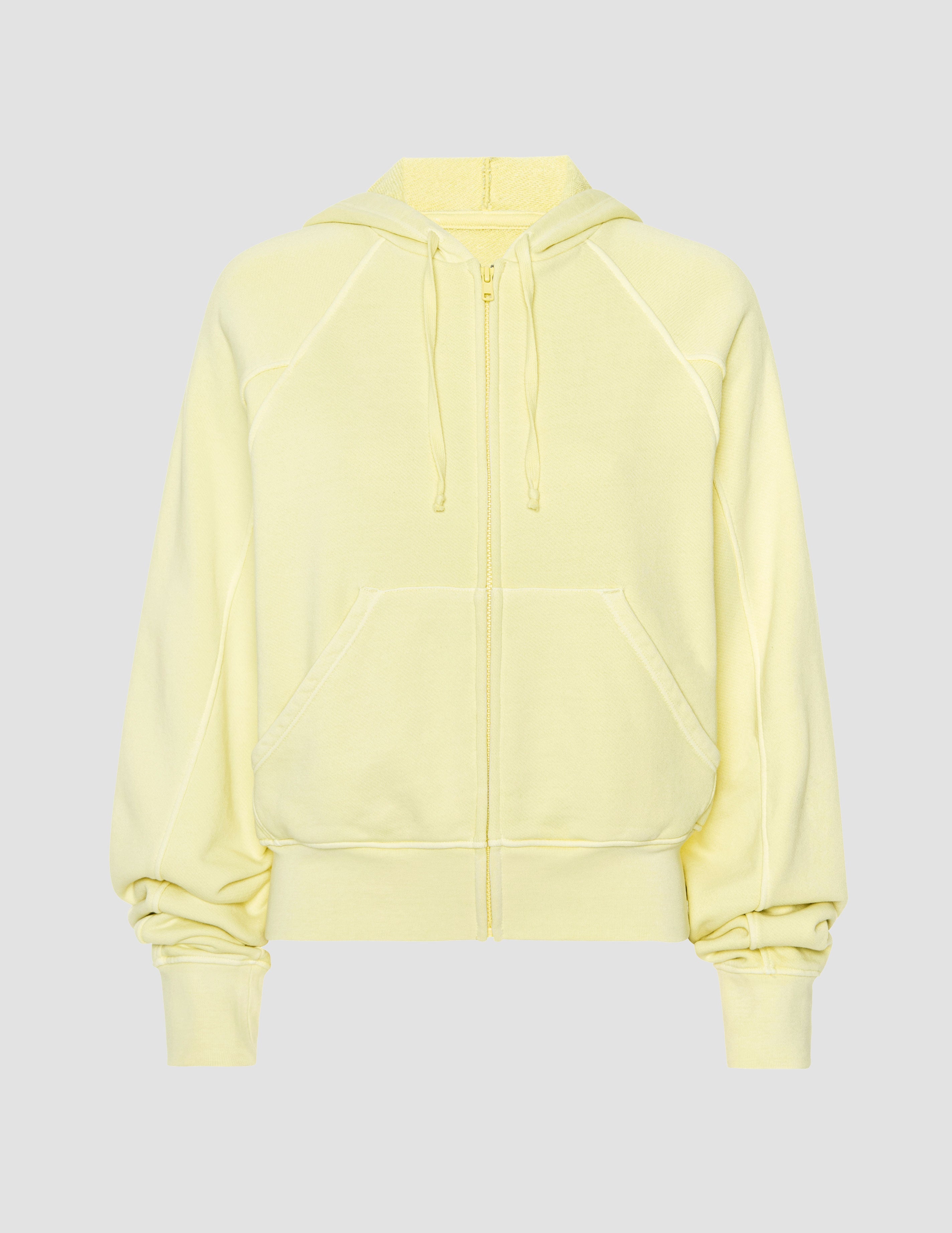yellow zip-up sweatshirt with pockets.