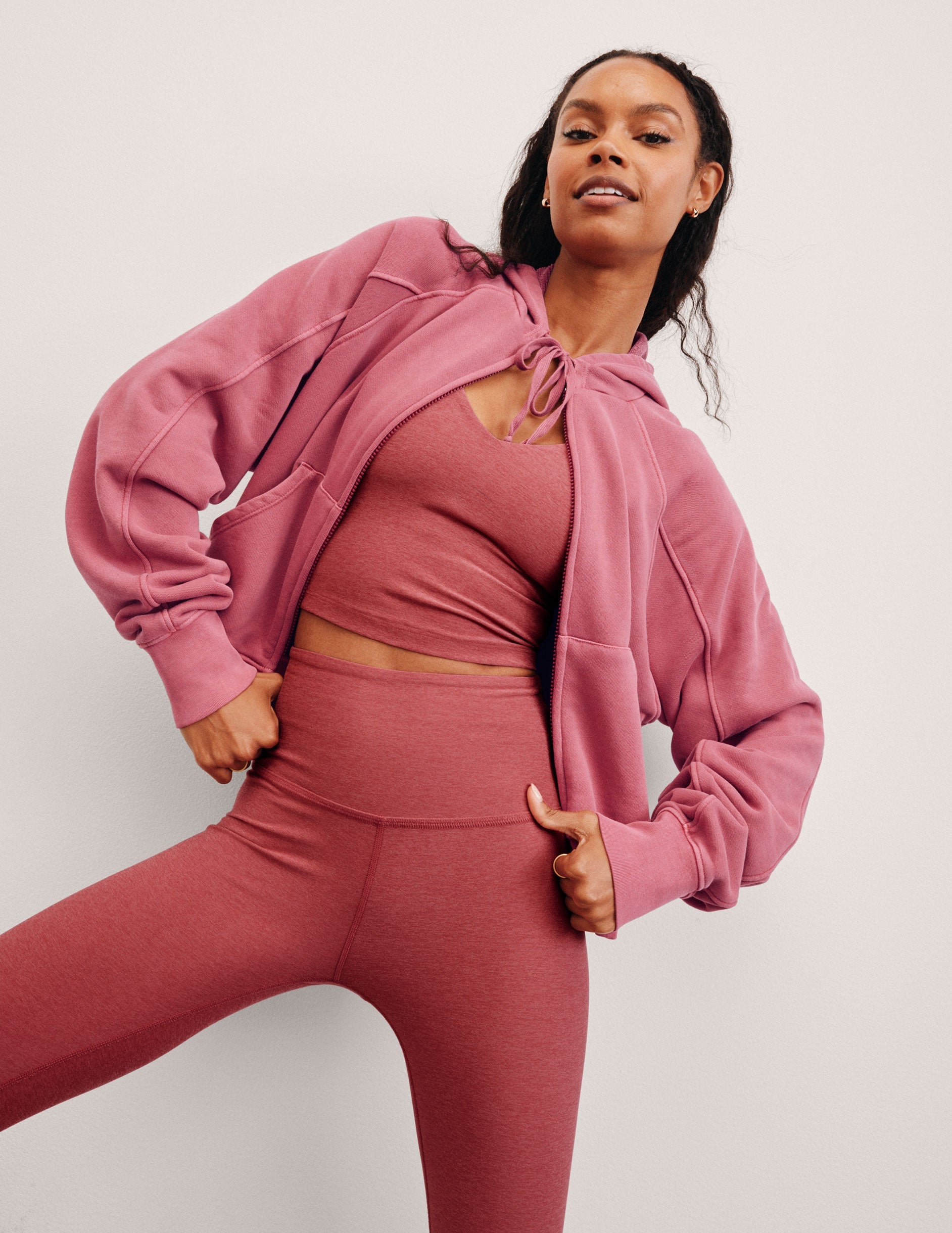 red garment dyed zip-up sweatshirt with pockets.