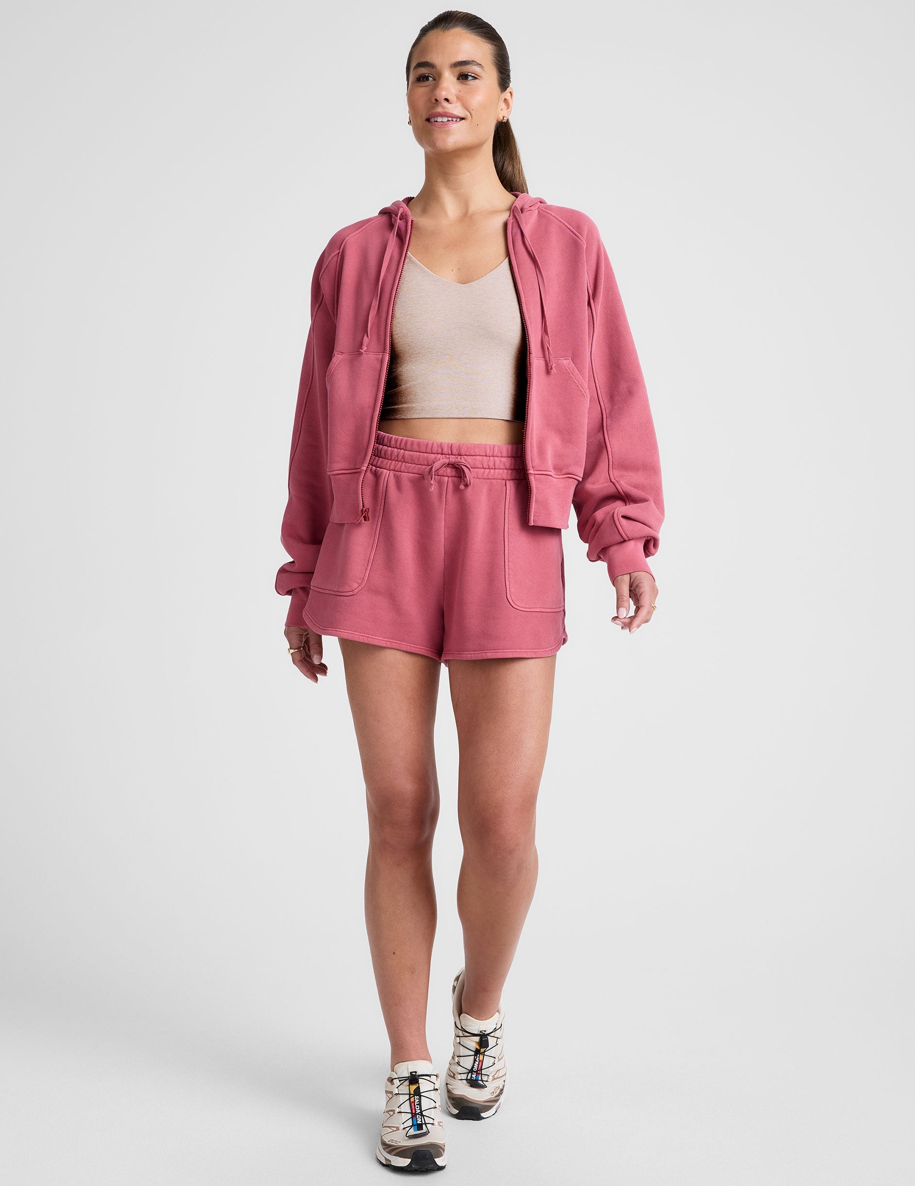 red garment dyed zip-up sweatshirt with pockets.