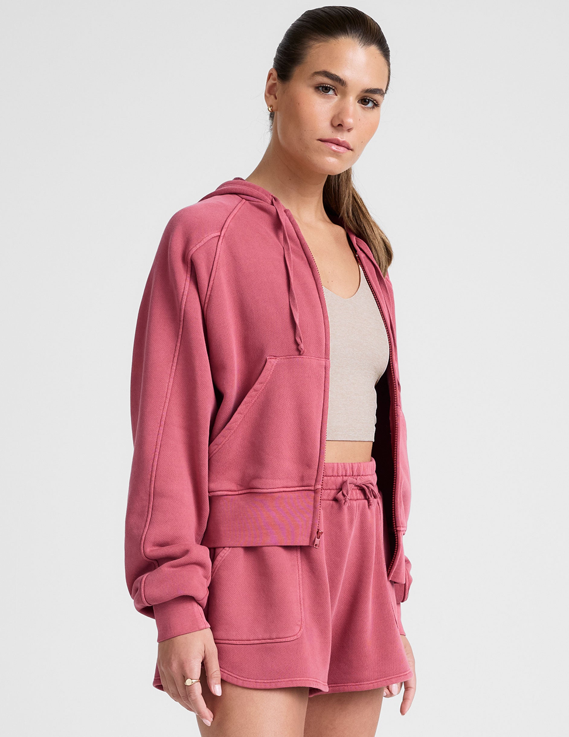 red garment dyed zip-up sweatshirt with pockets.