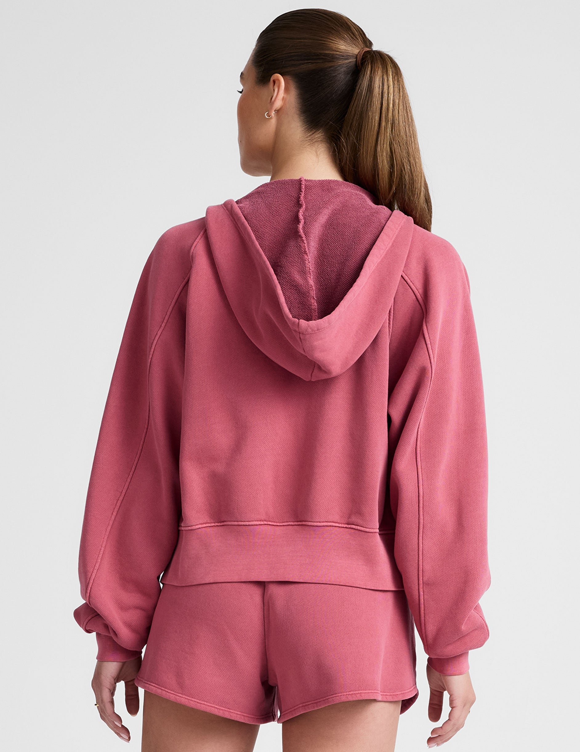 red garment dyed zip-up sweatshirt with pockets.